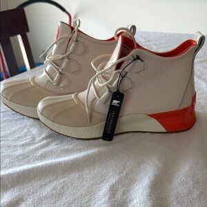 Sorel Cream and Orange Winter Boots Sleek Design